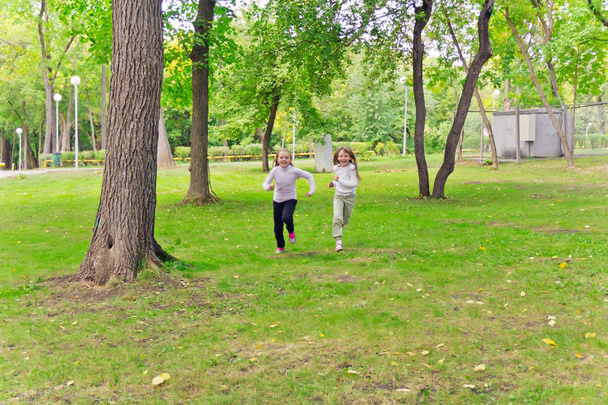 Cute two running girls - Valokuva, kuva