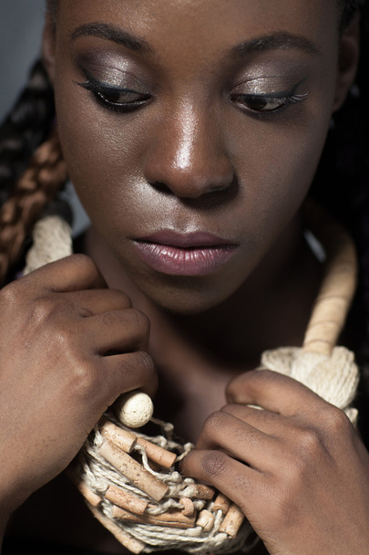 African woman with brilliant black skin - 写真・画像