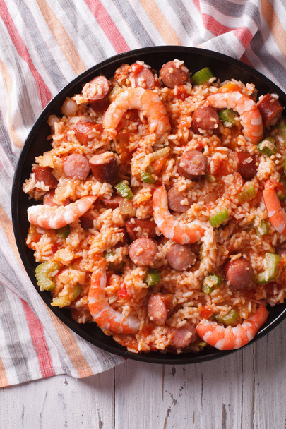  Creole jambalaya with shrimp and sausage close-up. vertical top - Fotó, kép
