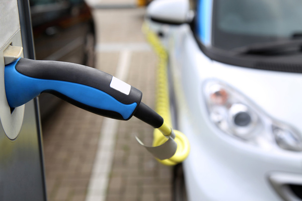 Electric car being charged at the station, close up of the power - Photo, Image
