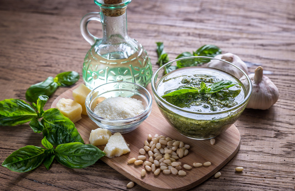 Pesto with ingredients on the wooden table - Photo, image