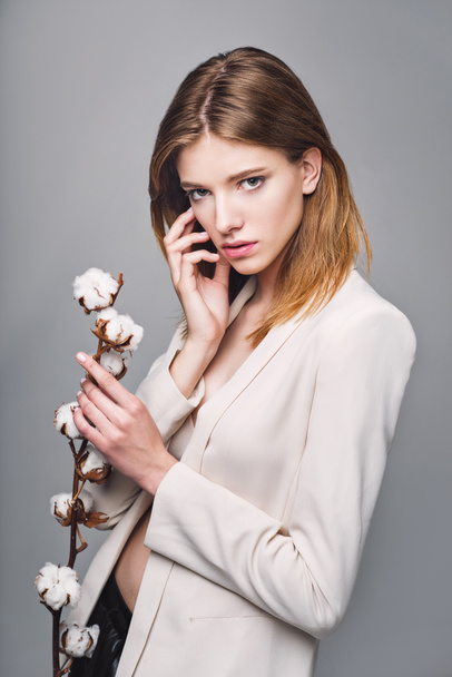fashion model woman with cotton plant balls in her hands  - Fotó, kép