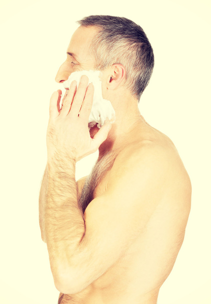 Mature man applying shaving foam - Foto, imagen