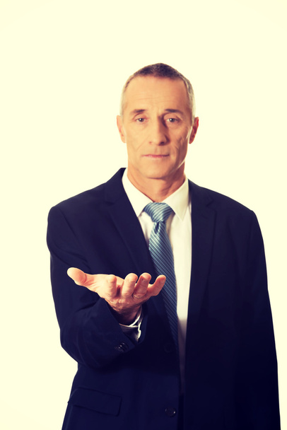 Businessman with outstretched hand - Photo, Image