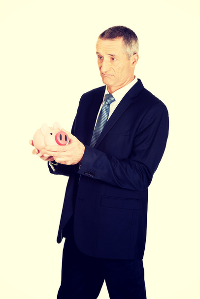 businessman holding piggy bank - Foto, imagen