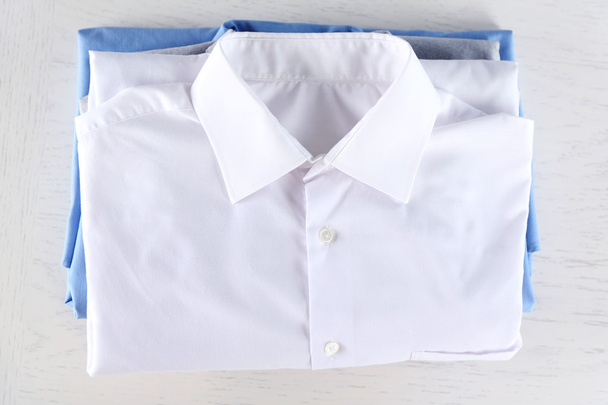 Business shirts on white table - Foto, afbeelding