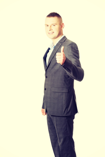 businessman gesturing thumbs up. - Foto, afbeelding