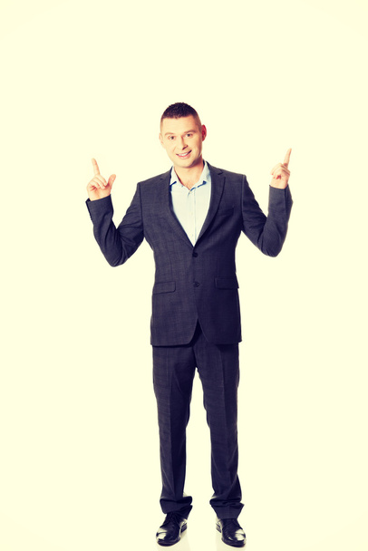 businessman pointing upwards - 写真・画像