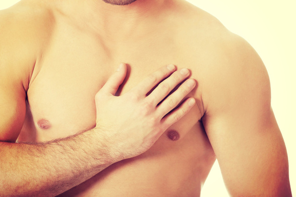 Athletic man feeling pain in his chest. - Photo, image