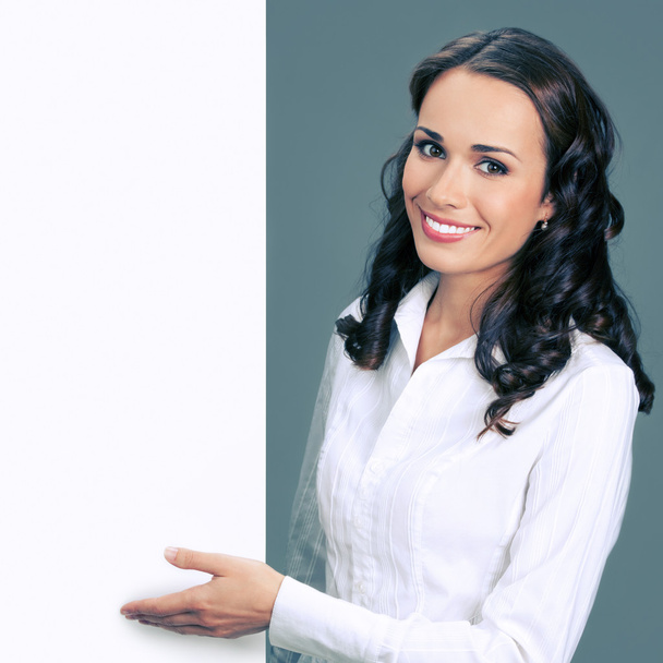 Young businesswoman showing blank signboard - Photo, Image