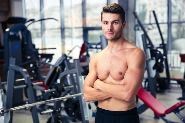 Man standing with arms folded at gym  - Foto, Imagem