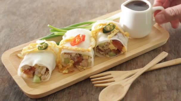 Serving spring rolls with vegetables on wooden plate - Footage, Video