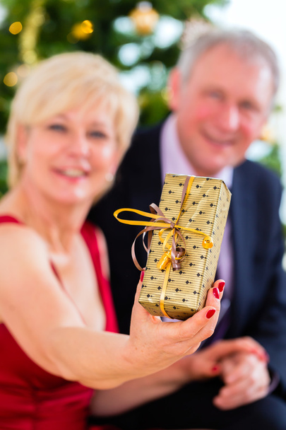 Senior couple celebrating Christmas eve - Photo, Image
