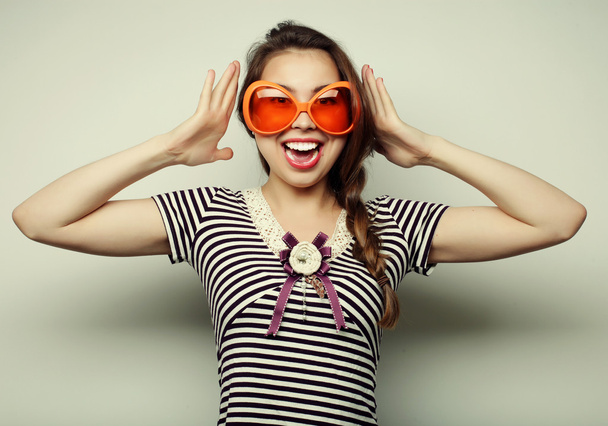 young woman with big party glasses - Foto, Bild