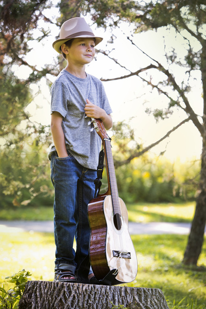 portrait of a little boy with guitar - Foto, imagen