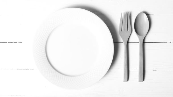 wood spoon and fork with dish black and white tone color style - Φωτογραφία, εικόνα