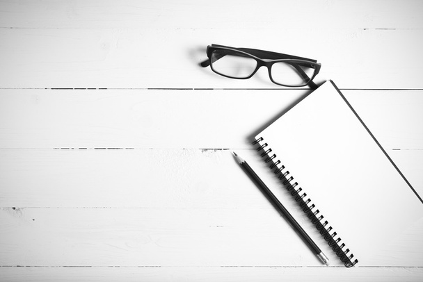 pencil and notepad with eyeglasses black and white color style - Photo, Image