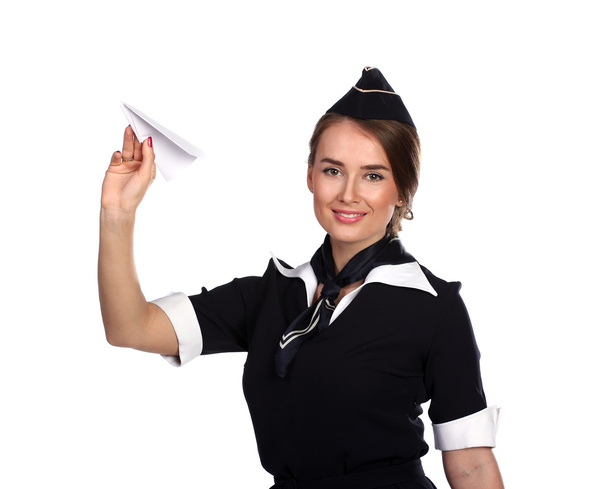 Air hostess with a paper airplane - Photo, image