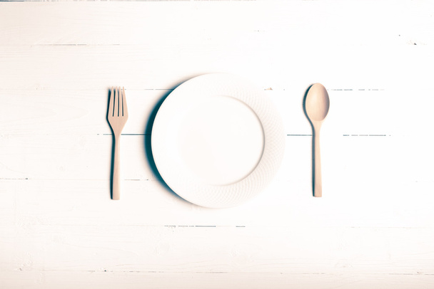 wood spoon and fork with dish vintage style - 写真・画像
