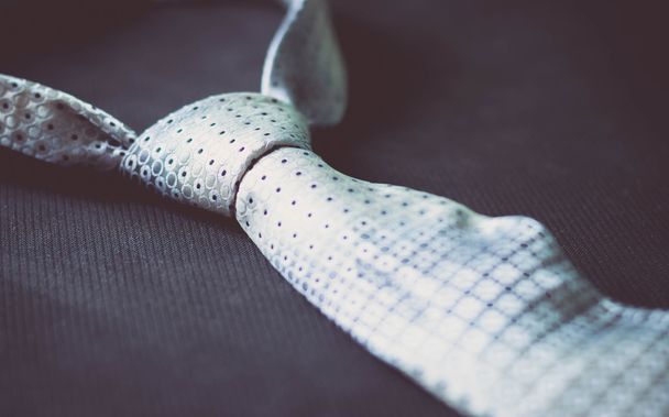 Vintage grey tie close-up - 写真・画像