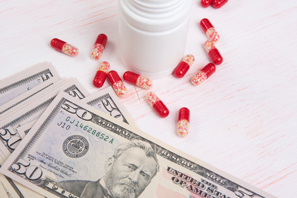Pills and money. Health care concept - Fotó, kép