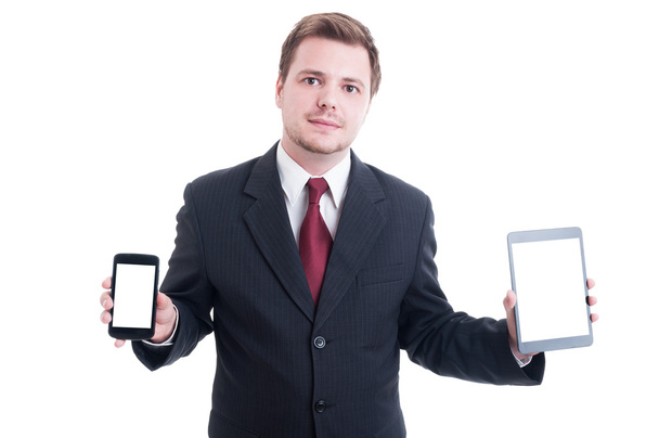 Pessoa de negócios segurando tablet e smartphone com branco branco s
 - Foto, Imagem