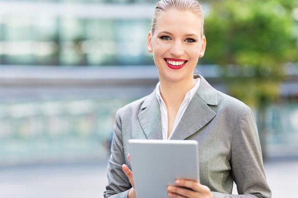Businesswoman using digital tablet - Photo, Image