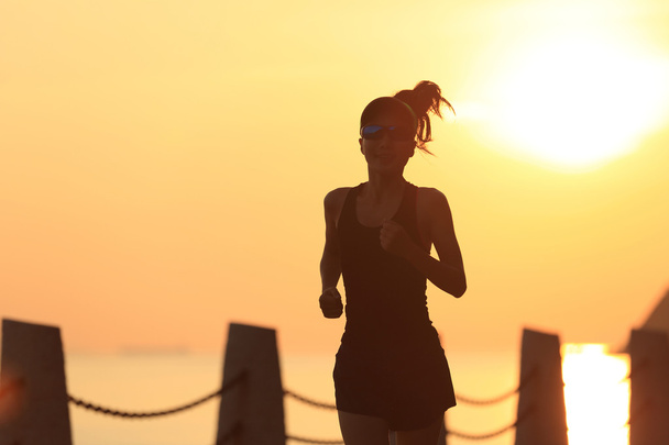 fitness woman running on seaside trail - Photo, image