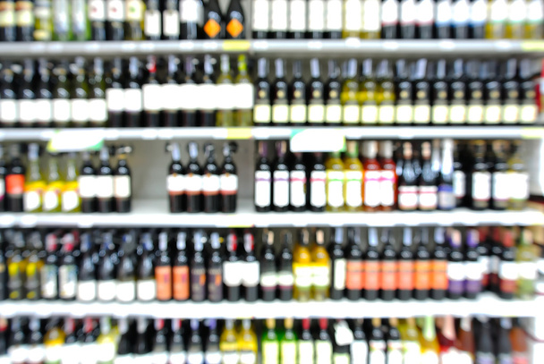 Abstract Blur or Defocus Background of Bottles of Wine on Shelf - Photo, Image