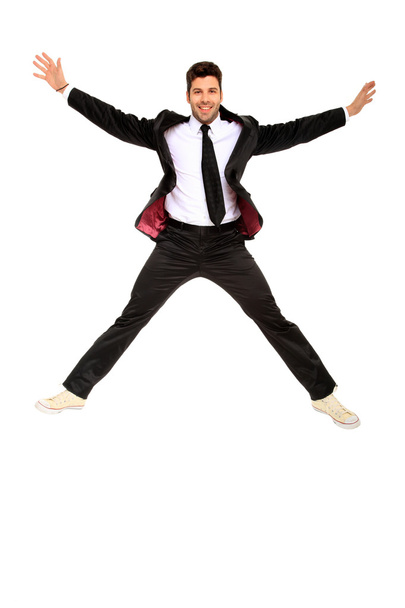 Handsome jumping man on suit - Zdjęcie, obraz