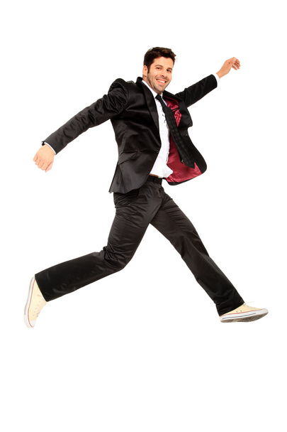 Handsome jumping man on suit - Фото, изображение