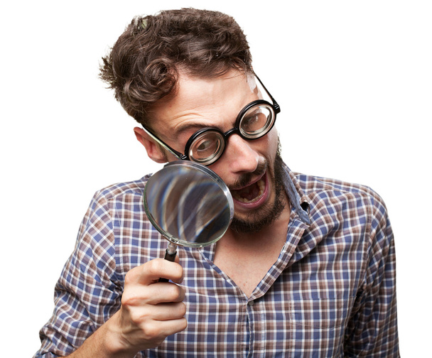 crazy young man with magnifying glass - Fotoğraf, Görsel
