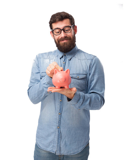 happy young man with piggy bank - Fotografie, Obrázek