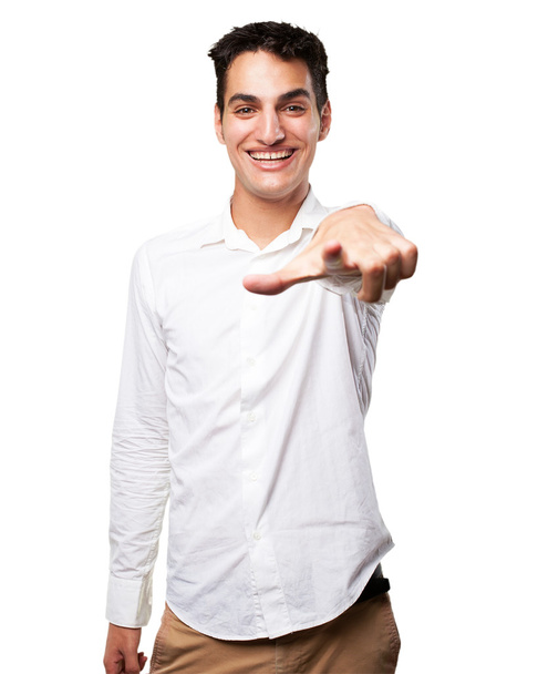  young man pointing front  - Valokuva, kuva