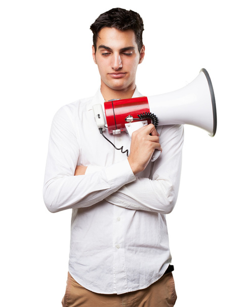 young man shouting with megaphone - Foto, Bild