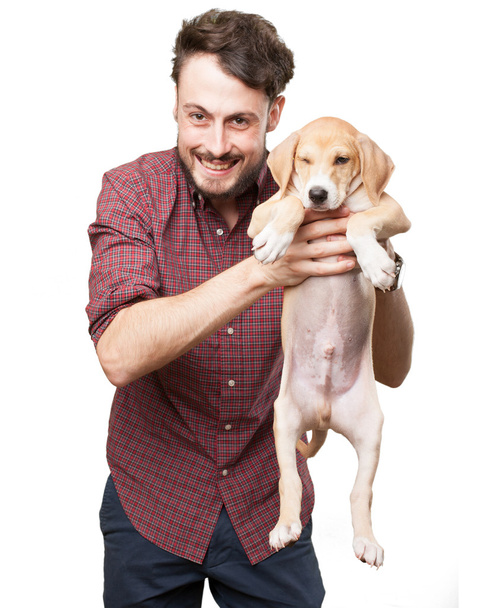 happy young man with puppy - Фото, зображення