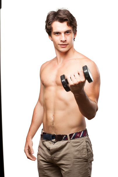 happy young man with dumbbell - Photo, image