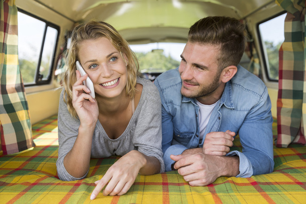 young couple with vintage camper van - Foto, immagini