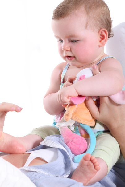 Baby sitting on her mother's chest - Zdjęcie, obraz