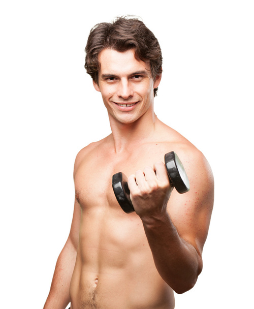 happy young man with dumbbell - Foto, imagen
