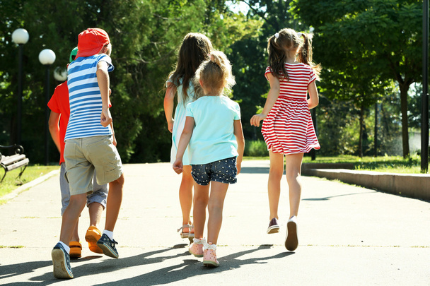 Happy active children running in park - Photo, image
