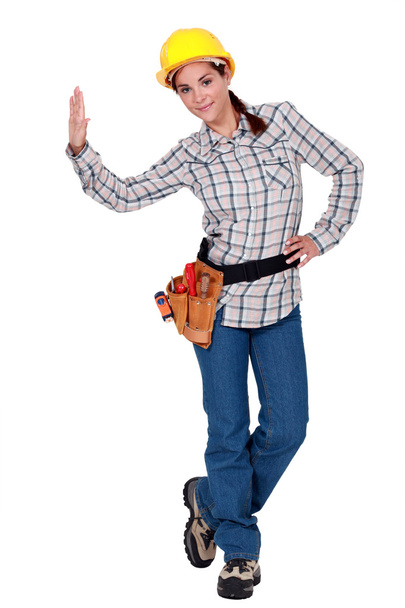 A female construction worker giving a high five. - Φωτογραφία, εικόνα