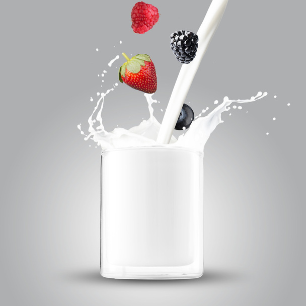 Berries falling into milk - Photo, Image