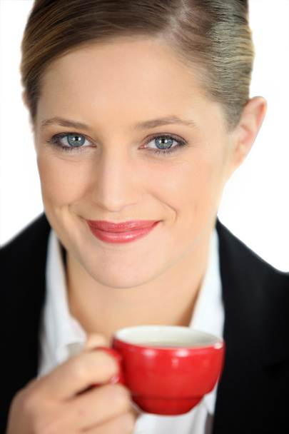 Businesswoman holding coffee mug - Photo, image