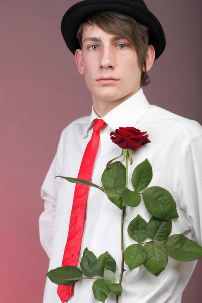 Portrait young man and rose enamoured love - Foto, Imagem
