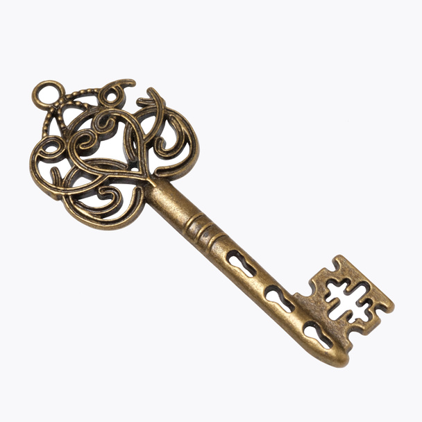 старий золотий ключ скелета ізольований на білому тлі
. - Фото, зображення