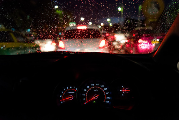 Abstract traffic jam  in raining day. View from car seat. - Φωτογραφία, εικόνα