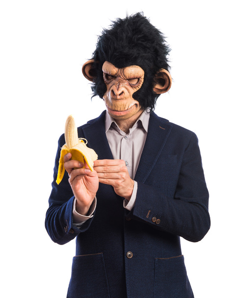 Человек-обезьяна ест банан
 - Фото, изображение