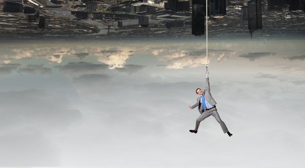 Man hang on rope - Foto, Imagen