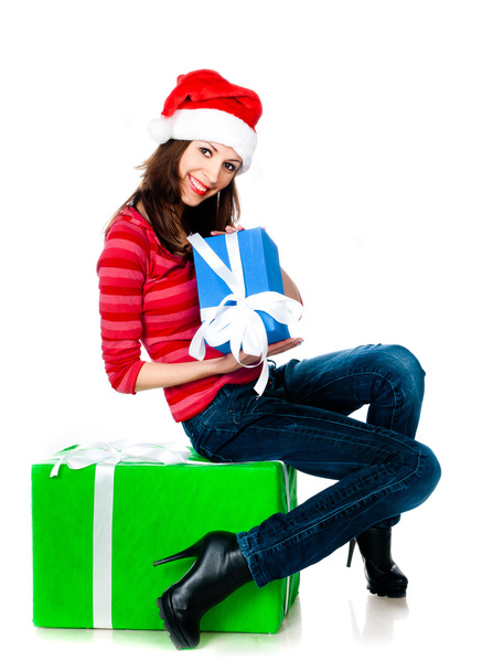 Girl in Santa hat with gifts - Photo, Image